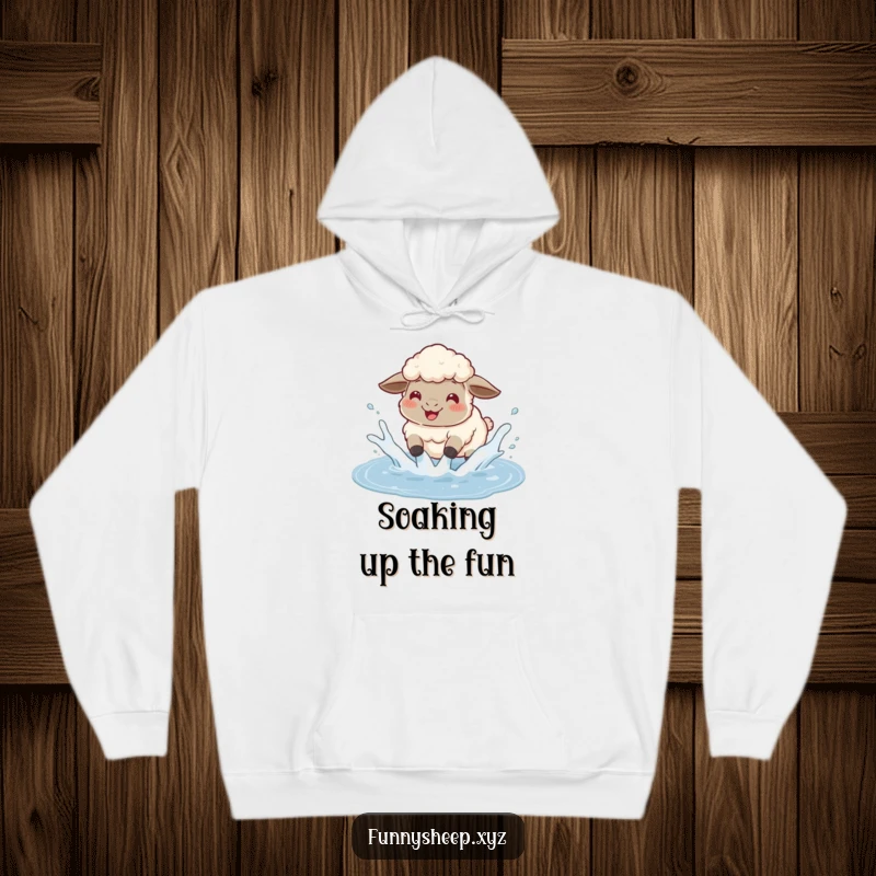 Funny sheep hoodie depicting a fluffy sheep gleefully splashing in a puddle, sending water flying with pure happiness.